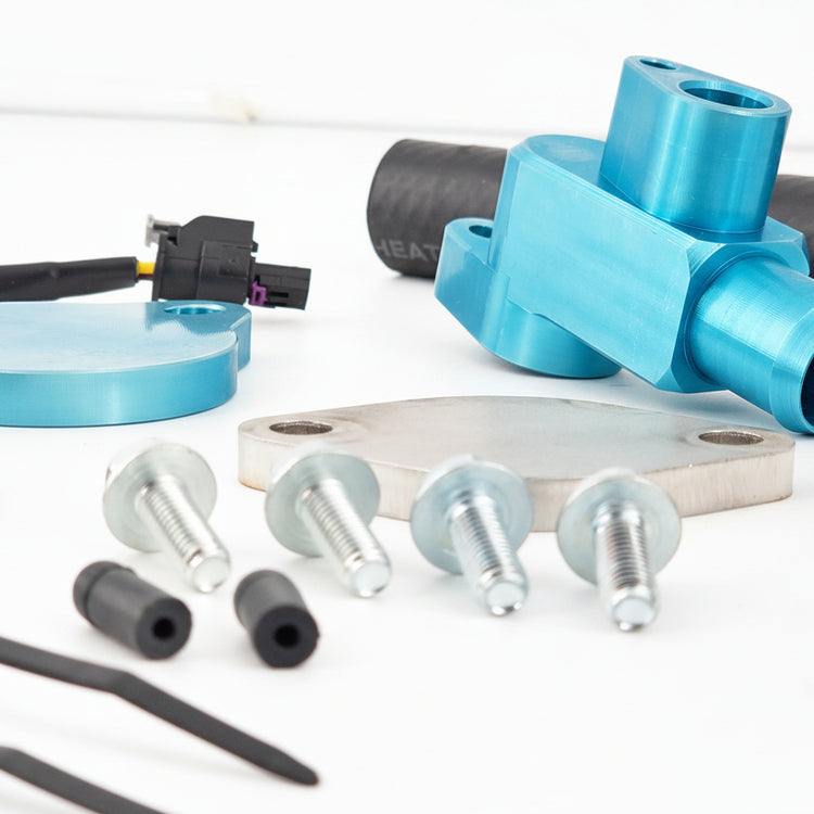 Blue mechanical components and hardware on a white surface