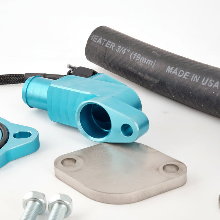 Turquoise valve stem, black heater pipe, and metal components on a white background